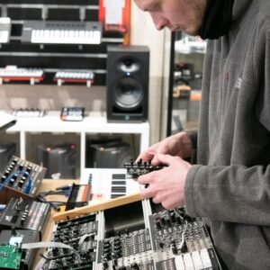 a man is working on an electronic device